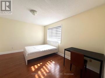 Markham (Milliken Mills East) apartment for rent - A bedroom with a bed, desk, and chair.