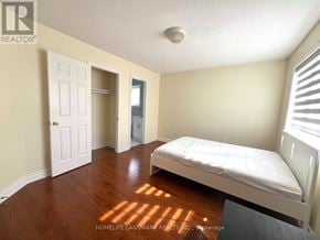 Markham (Milliken Mills East) apartment for rent - A bedroom with a bed, dresser, and closet.
