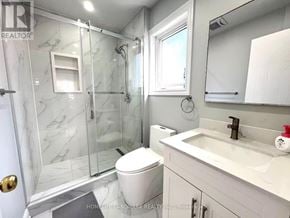 Markham (Milliken Mills East) apartment for rent - A bathroom with a marble shower and white toilet.