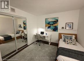 Toronto (Mount Pleasant West) condo for rent - A bedroom with a bed, desk, and chair.