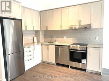 Markham (Unionville) condo for rent - A kitchen with a refrigerator, oven, and sink.