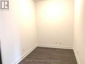 Markham (Unionville) condo for rent - A room with a wooden floor and white walls.