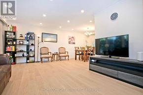 Toronto (Don Valley Village) apartment for rent - A living room with a flat screen TV and a bookshelf.