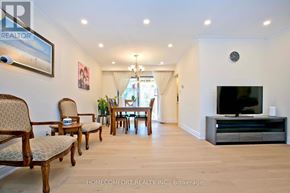 Toronto (Don Valley Village) apartment for rent - A living room with a row of chairs and a television.