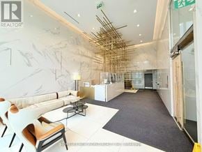 Toronto (Church-Yonge Corridor) condo for rent - A modern office space with a white and grey color scheme and a unique wooden beam ceiling.