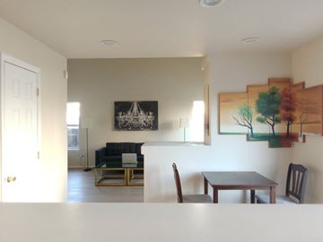 Colorado Springs apartment for rent - A living room with a couch, chair, and painting on the wall.