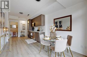 Toronto (Newtonbrook East) townhouse for rent - A dining room with a glass table and chairs.