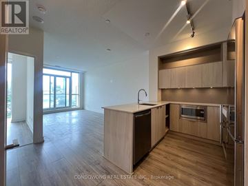 Toronto (Regent Park) condo for rent - A kitchen with wooden cabinets and a modern design.
