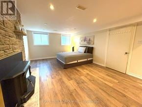 Toronto (Markland Wood) apartment for rent - A bedroom with a bed, dresser, and television.