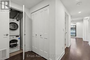 Ottawa condo for rent - A laundry room with a washer and dryer in it.