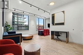Ottawa condo for rent - A modern living room with a fireplace and a large mirror on the wall.