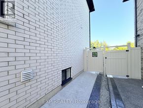 Pickering (Highbush) apartment for rent - A white brick wall with a small window and a vent on the side.