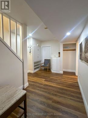 Mississauga (Lisgar) apartment for rent - A hallway with wooden floors and white walls.