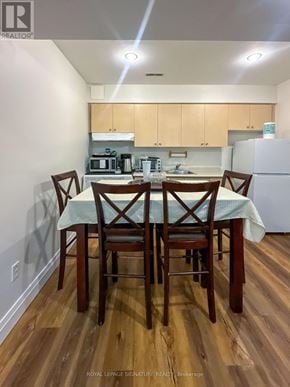 Mississauga (Lisgar) apartment for rent - A kitchen with a table and chairs in the foreground.