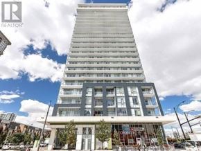 Mississauga (City Centre) condo for rent - A tall building with a glass facade and a sign that reads "SMART WAY".
