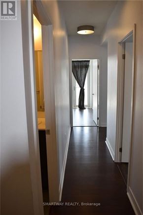 Mississauga (City Centre) condo for rent - A long hallway with a curtain at the end.