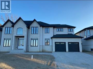 Lasalle apartment for rent - A large, modern house with a black roof and multiple windows is shown.
