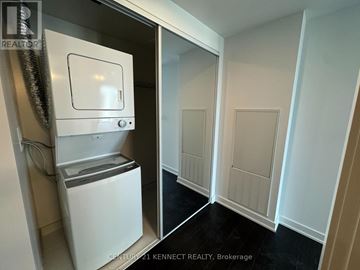 Toronto (Kensington-Chinatown) condo for rent - A small white refrigerator is in a kitchen pantry.