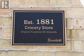 West Grey apartment for rent - A plaque on a brick wall that says Est. 1881 Grocery Store.