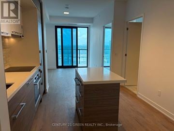 Toronto (Bayview Village) condo for rent - A kitchen with wooden floors and a counter top.