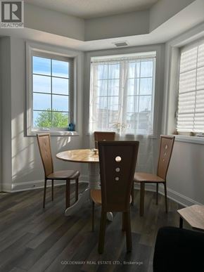 Clarington (Newcastle) condo for rent - A dining room with a table and chairs.