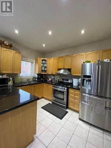 Markham (Cedarwood) apartment for rent - A kitchen with wooden cabinets and a black counter top.
