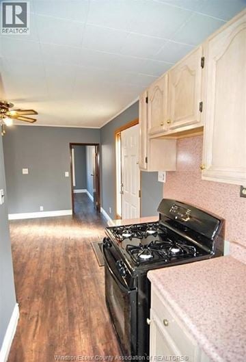 Windsor apartment for rent - A kitchen with a black stove top oven and wooden floors.