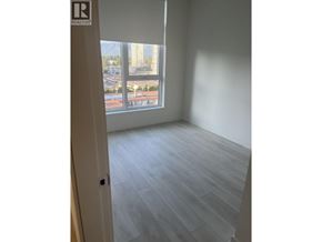 Coquitlam apartment for rent - A room with a window overlooking a street.