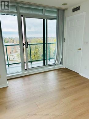 Toronto (Willowdale West) condo for rent - A room with a sliding glass door leading to a balcony.