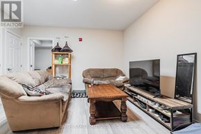 Toronto (East End-Danforth) apartment for rent - A living room with a couch, chair, coffee table, and television.