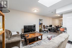 Toronto (East End-Danforth) apartment for rent - A living room with a couch, a coffee table, and a television.