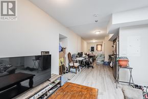 Toronto (East End-Danforth) apartment for rent - A living room with a television and a couch.