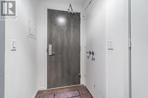 Toronto (Church-Yonge Corridor) condo for rent - A door with a glass panel and a handle is in the center of the image.