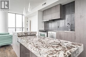 Toronto (Church-Yonge Corridor) condo for rent - A modern kitchen with a marble countertop and stainless steel appliances.