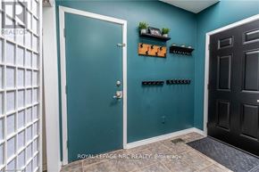 Niagara Falls (West Wood) apartment for rent - A blue door is in a room with a black door and a white door.