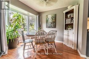 Niagara Falls (West Wood) apartment for rent - A room with a table and chairs and a plant.