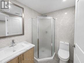 St. Catharines (E. Chester) multi-family for rent - A bathroom with a sink, toilet, and shower.