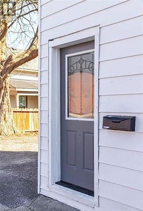 Brantford apartment for rent - A mailbox is on the right side of a grey door.