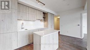 Toronto (Annex) condo for rent - A white kitchen with a sink and a counter.