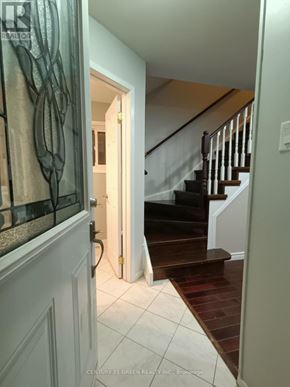 Ajax (Central West) apartment for rent - A hallway with a staircase and a glass railing.