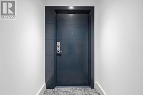 Hamilton (Durand) condo for rent - A black door with a handle and a sign on it.