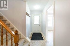 Hamilton (Stoney Creek Mountain) apartment for rent - A hallway with a staircase and a door.