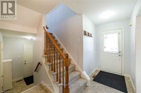 Hamilton (Stoney Creek Mountain) apartment for rent - A hallway with a staircase and a door on the right.