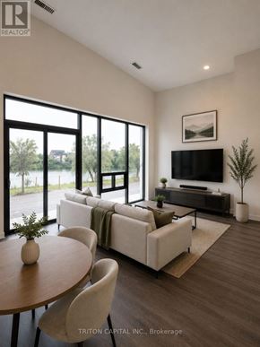 Welland (Broadway) condo for rent - An aerial view of a large building complex with a body of water in front of it.