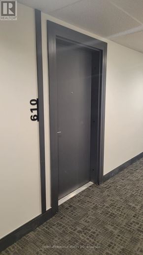 Brantford condo for rent - A door with the number 610 on the wall next to it.