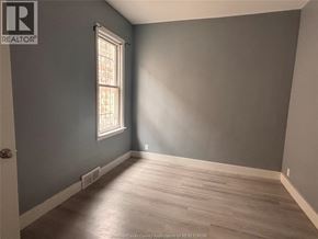 Windsor apartment for rent - A room with a window and wooden flooring.