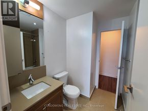 Toronto (Mount Pleasant East) condo for rent - A bathroom with a sink, toilet and a door.