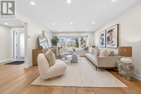 Toronto (L'amoreaux) apartment for rent - A spacious living room with a beige sofa, a chair, and a coffee table.