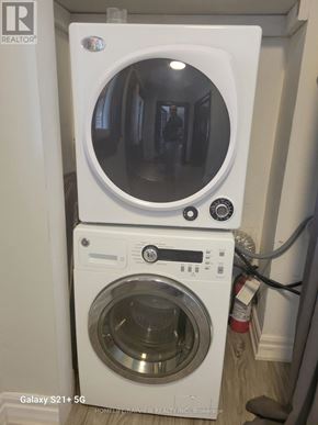 Markham (Old Markham Village) apartment for rent - A white washing machine with a dryer on top of it.