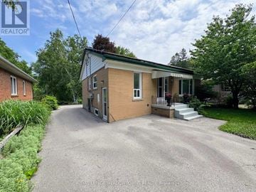 Halton Hills (Georgetown) apartment for rent - A house with a driveway in front of it.